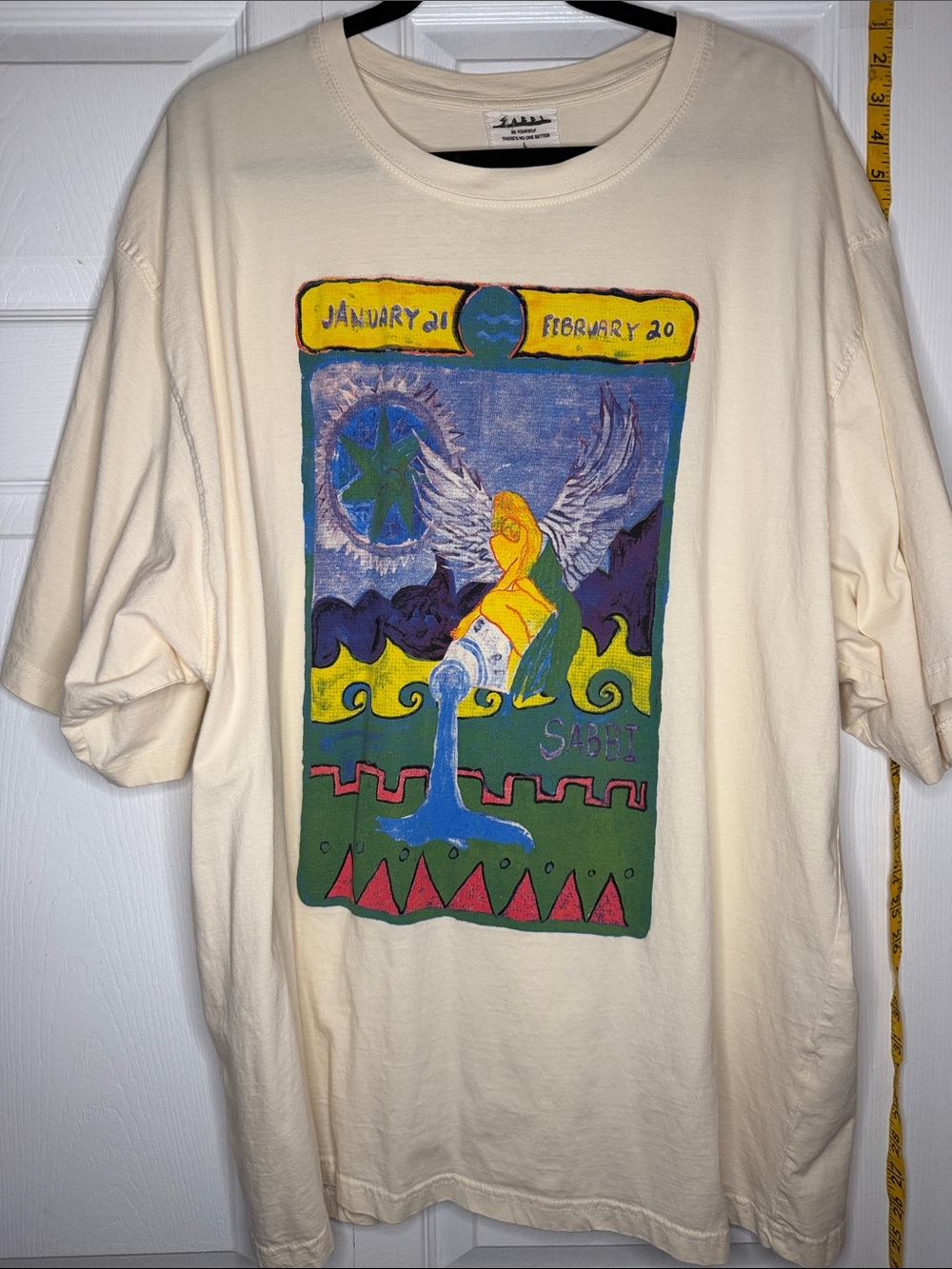 SABBI Cream Zodiac Graphic Tee - Aquarius Design